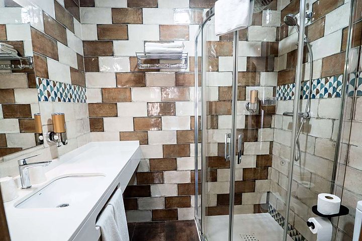 Bathroom with handmade tiling and shower